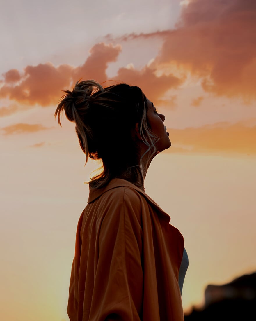 Woman Looking Towards the Sky